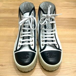 Chanel high top sneakers. White, black and gold. Size 38.